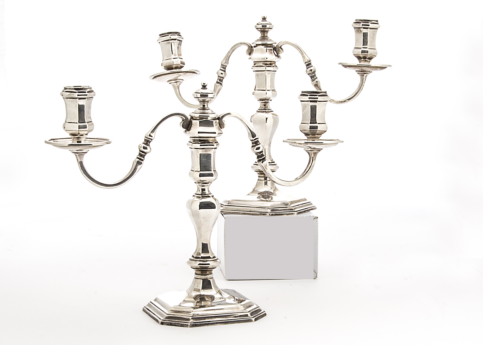 A nice pair of 1970s silver candelabra by BS, the Georgian taste cast octagonal bases supporting a