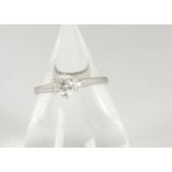 An 18ct white gold diamond solitaire, the brilliant cut in six claw setting on a white gold shank,