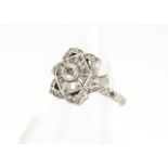 An 18ct gold Art Deco style diamond set tablet ring, the central diamond with lozenge shaped central