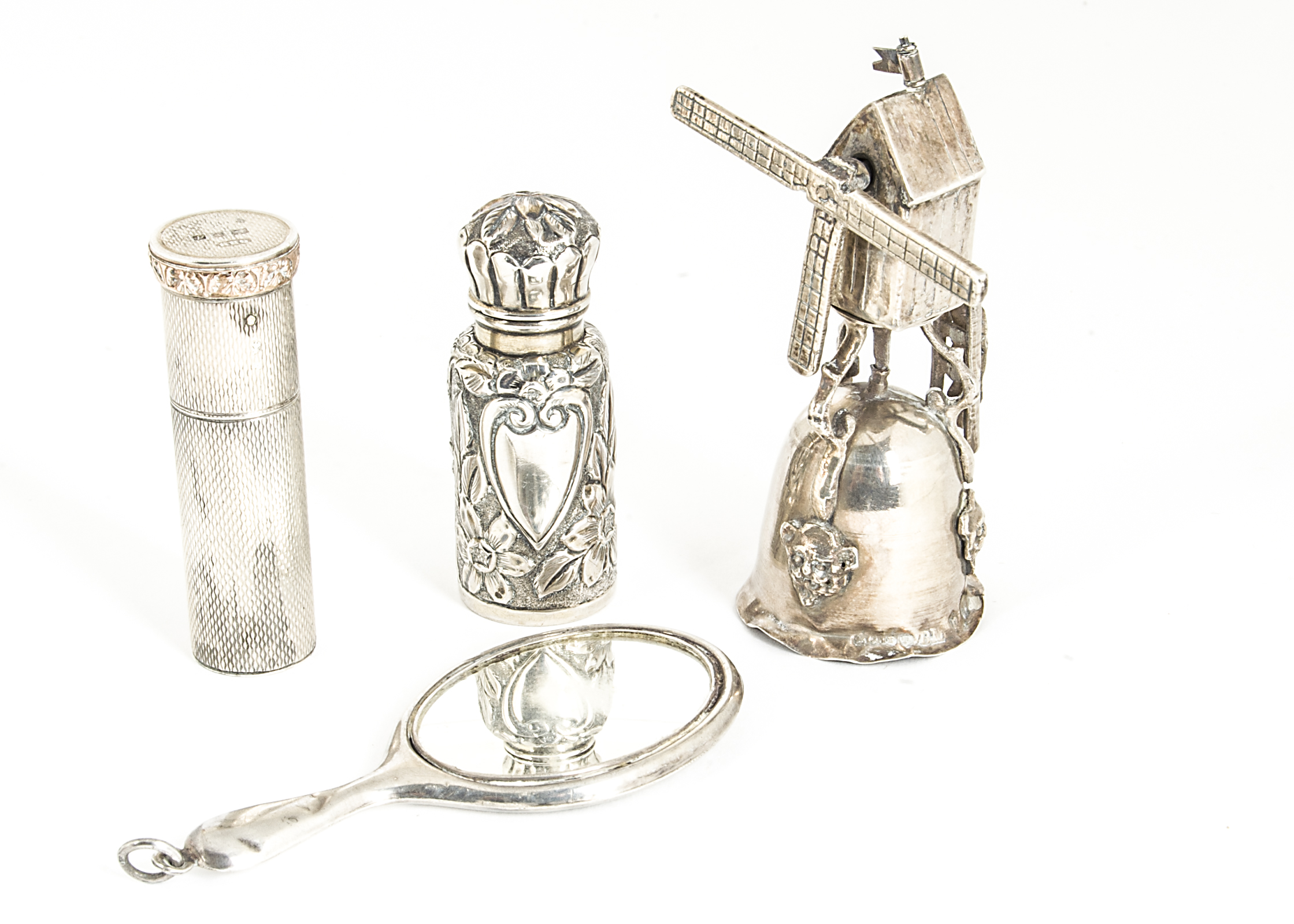 Four early to mid 20th Century collectable silver items, including a Dutch windmill cup, AF, a