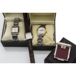 Four boxed modern Dunhill watches, one a Photo Frame Quartz Watch, the other a stainless steel on