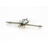 A white metal bug bar brooch, the bug with blue oval paste set abdomen and a smaller mixed round cut