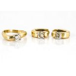 A gold diamond suite, comprising a solitaire dress ring in white gold twist setting on yellow gold