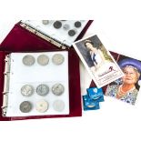 A collection of British coins, in two albums, loose and in packets, one album with some Victorian,