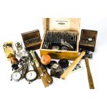 A collection of vintage and modern watch repairing tools and other items, including a Favorite