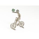 A small early 20th Century silver model of a cyclist from Berthold Muller, the boy riding the bike