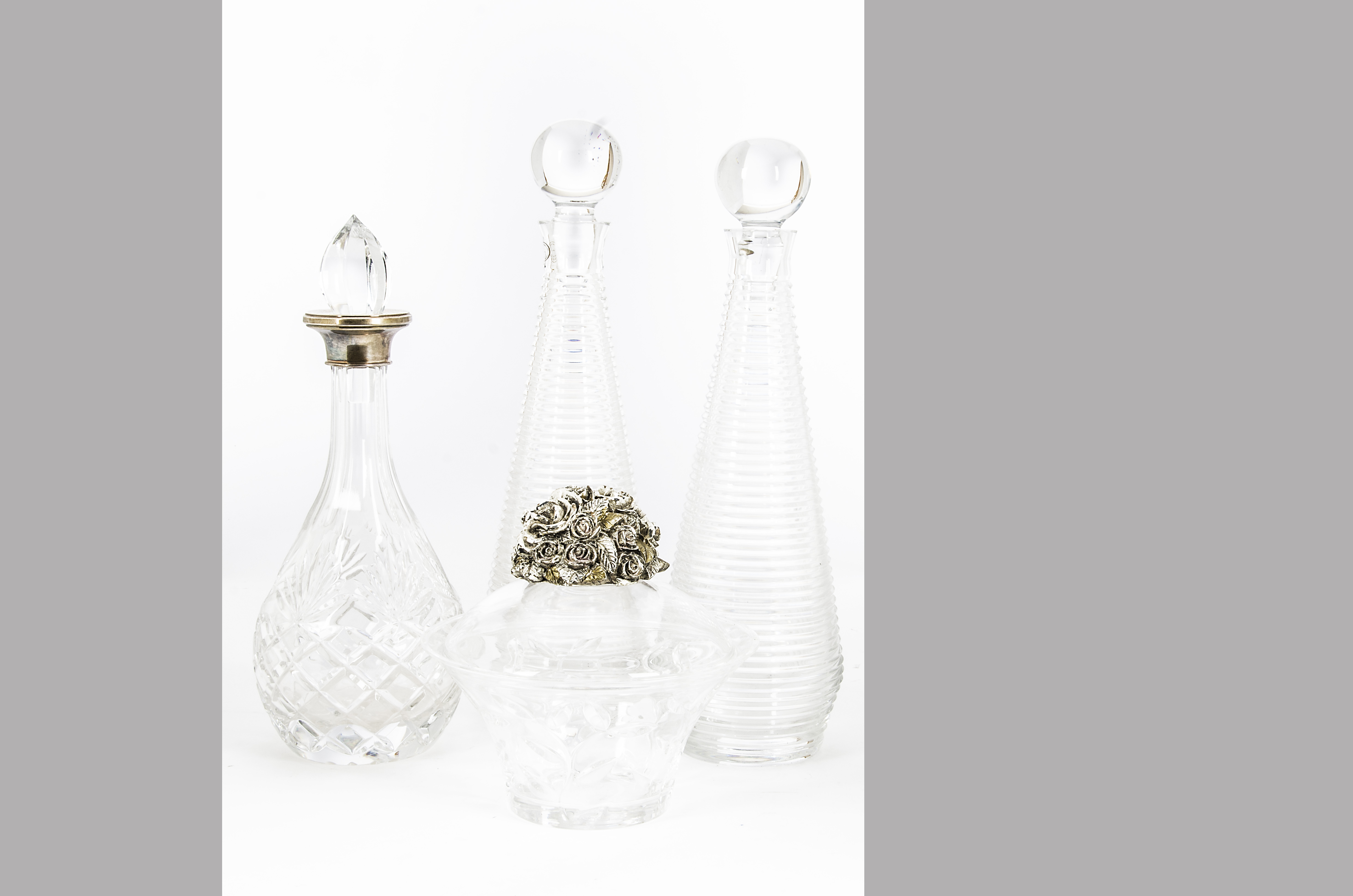 A modern glass and silver collared decanter with stopper, together with a pair of modern Hungarian