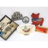 A small collection of animal brooches, including a silver airedale bar brooch, a David Shepherd