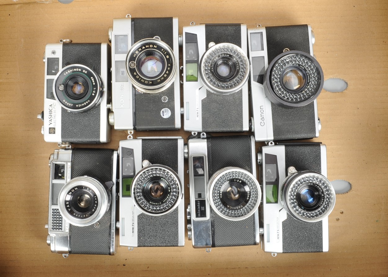 A Tray of Rangefinder Cameras, a Canon Canonet, Petri 7s (3), Yashica Electro 35, Minister II, III