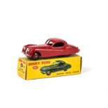 A Dinky Toys 157 Jaguar XK120 Coupe, red body and hubs, in original box, E, box VG