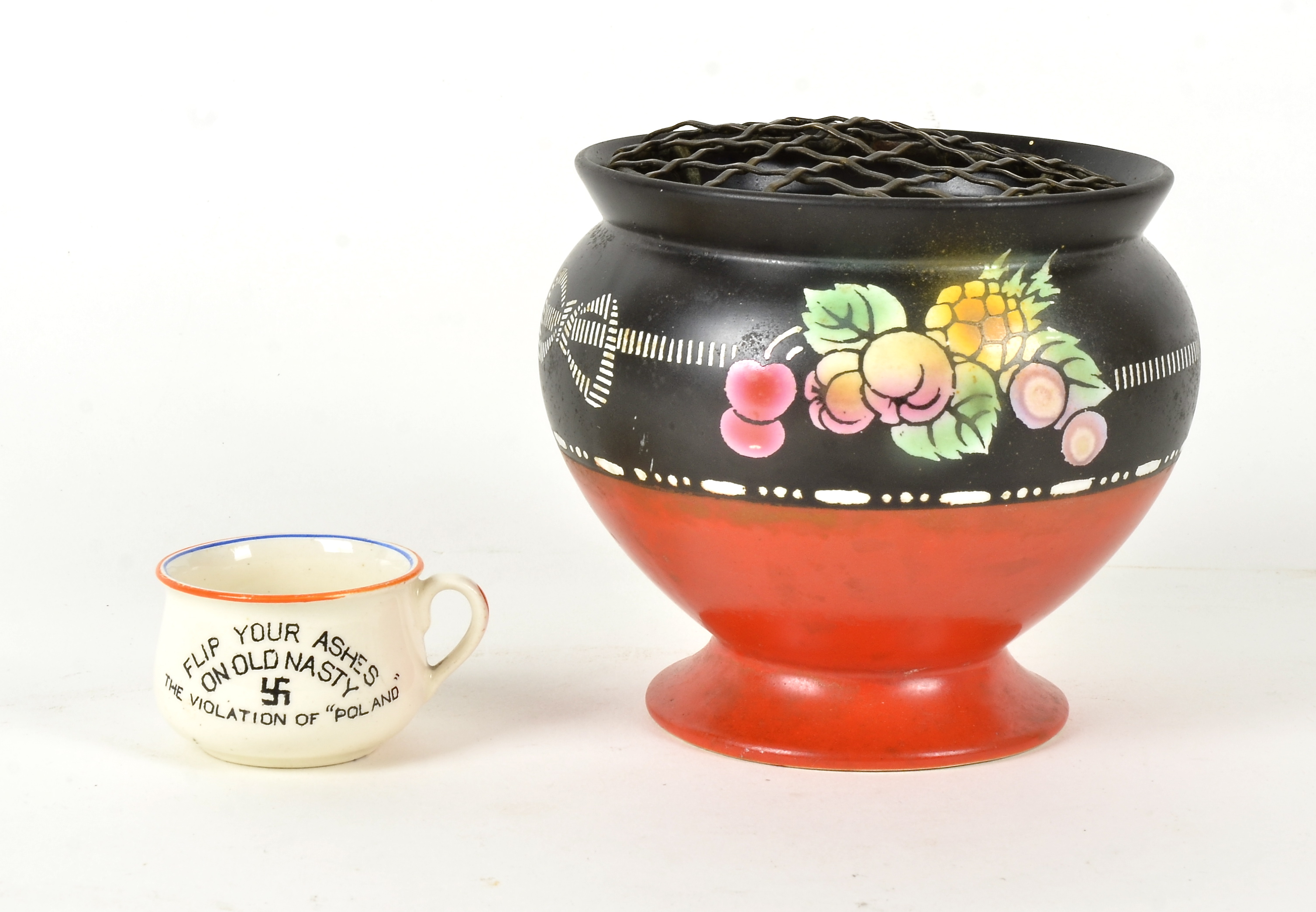 A Shelley bellpan ashtray, with a red glazed circular base and decorated with fruit, height 11cm,