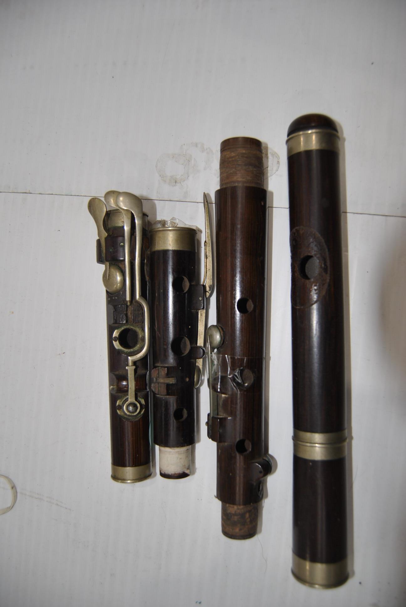 Flutes, three antique rosewood flutes for restoration