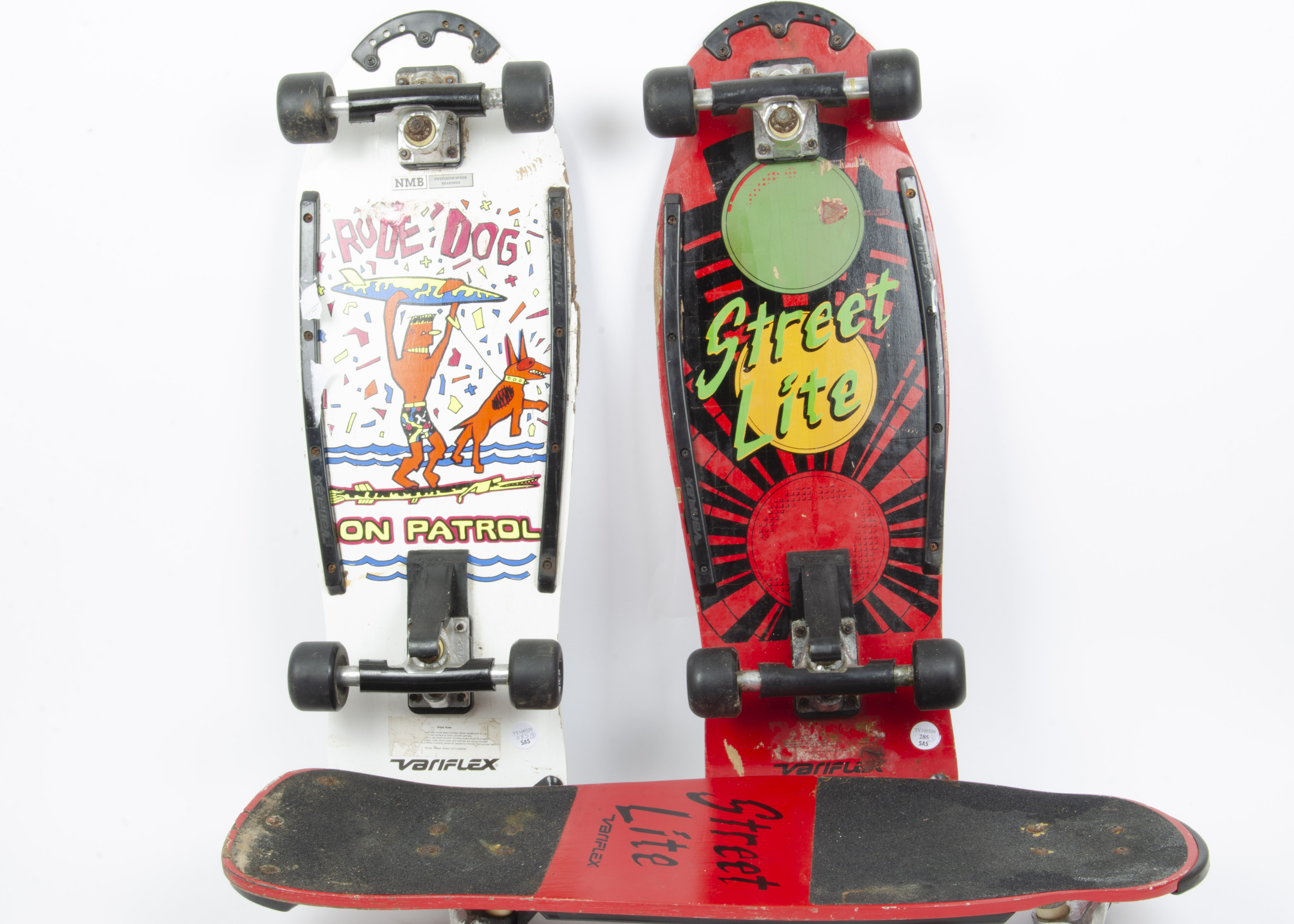 Three Variflex Skateboards, Street Life in red and black (2) and Rude Dog on Patrol in white, F, all