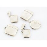 five late 19th and early 20th century silver vesta cases, each plain, including a circular