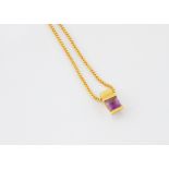 A continental amethyst gold pendant, bearing French strike marks, on a fine square linked gold chain