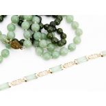 A 9ct gold and jade bracelet, the polished jade shaped rectangular links with gold spacers and