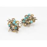 A pair of continental yellow metal and turquoise ear studs, marked 18k, the cabochon blue stones