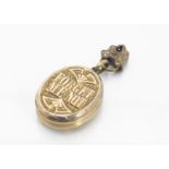 A 19th Century gilt metal oval locket, with the inscription 'Forget me Not' with a miniature padlock