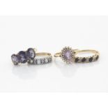 Four 9ct gold gem set dress rings, including a three stone amethyst ring, ring size L 1/2, an