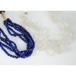 A large contemporary rock crystal neckalce, with silver snap clasp, 51cm and a blue glass bead multi