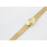 A c1970s Rolex 18ct gold lady's wristwatch, 12mm wide oval textured case, appears to run, with