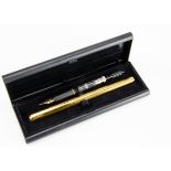 A modern Mont Blanc fountain pen, gold plated, with box and spare inner