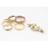 Three 22ct gold wedding bands, 5.1g, a diamond chip gold ring (af), two 9ct gold rings and a 9ct