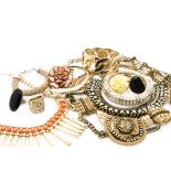 A collection of costume jewellery, including various bangles, ornate gilt necklaces and other items