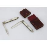 A cased George III silver and mother of pearl campaign knife and fork set, each folding with inset