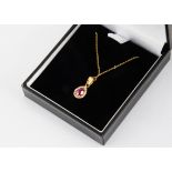 A synthetic ruby and paste drop pendant, in 18ct gold, on a fine 18ct gold chain, 2.1g, 24cm