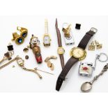 A 9ct gold Masonic tie pin, together with a 9ct gold lady's wristwatch, a Tissot Seastar 7