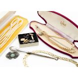 A large collection of costume jewellery, including a 9ct gold ring mount, a 9ct gold bracelet,