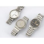 Three c1970s Seiko 5 automatic stainless steel gentlemens wristwatches, one with black dial, another