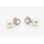 A pair of 18ct old diamond and cultured pearl drop earrings, with a contemporary scroll set