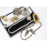 A collection of costume jewellery including a Victorian silver brooch, a simulated turquoise ring,