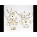 A George V silver four piece Scottish silver tea set by JF, Glasgow 1927, comprising teapot, hot