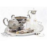 A collection of silver plate, including a large Edwardian oval twin handled tray, a cut glass claret