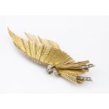 A continental 18ct gold and diamond wing brooch, the diamonds set in claw white gold settings