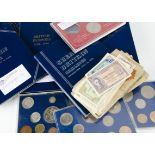 A collection of coins, in albums and folders, and also some loose in plastic pockets, varying from