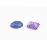 A synthetic colour change corundum, step cut together with a synthetic lapis lazuli cabochon