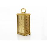 A gilt timepiece by Jaeger Le Coultre, no. 494, rectangular with pierced sides, eight day