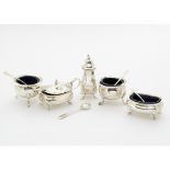 A five piece George V period silver cruet items, with blue glass liners and four spoons, one