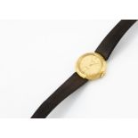 A c1980s Rolex gold cased lady's wristwatch, 21mm, gold coloured dial with batons, with textured