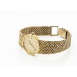 A c1980s Omega de Ville gold plated lady's wristwatch, 24mm case on integrated mesh strap, manual