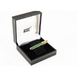 A modern Mont Blanc tie clip, in box, silver gilt with panel of malechite