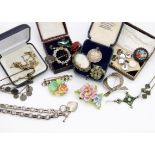 A collection of jewellery, including a silver necklace, carnelian ring, floral brooches, cameo