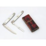 A cased George III silver and mother of pearl campaign knife and fork set, each folding with