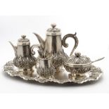 A c1960s Thai silver five piece coffee and tea set, comprising tray, teapot, coffee pot, covered