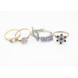 Five gold gem set dress rings, including three in yellow gold and two in white, set with diamonds,