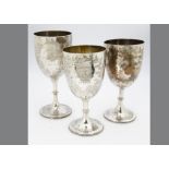 Three Victorian silver trophy goblets, one damaged, each won by Sylvia, all in 1877, from Weymouth